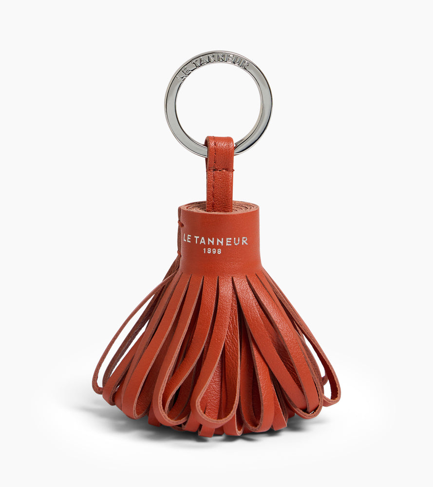 Porte clés pompons en cuir lisse